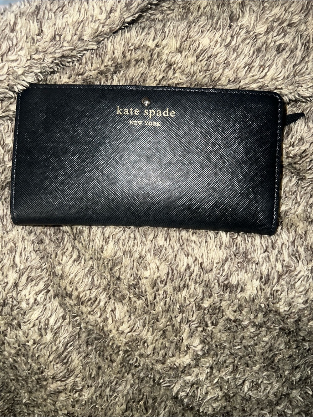 kate spade black leather zip-around wallet with gold logo